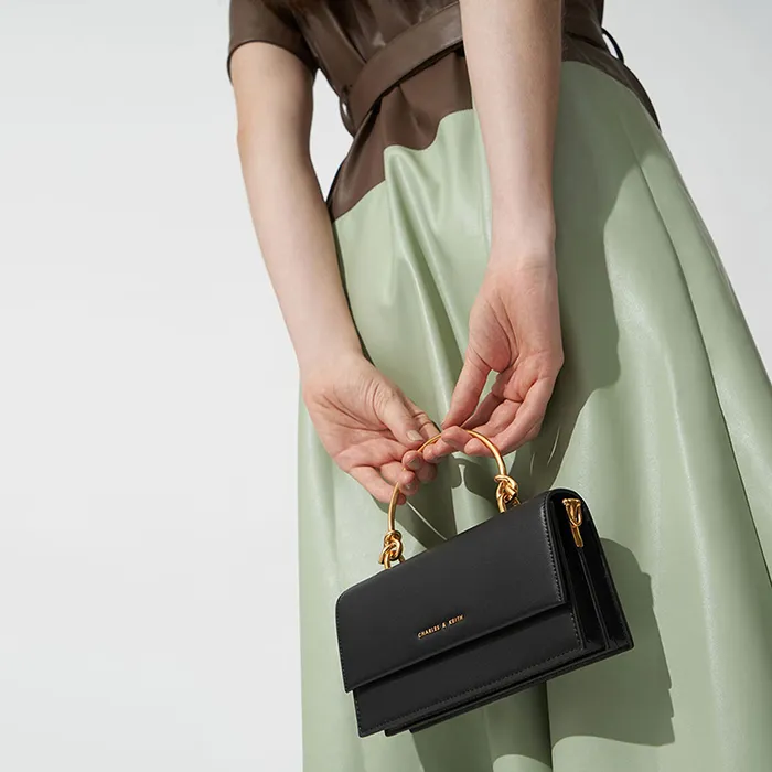 Túi Cầm Tay Nữ Charles & Keith CNK Metal Top Handle Long Wallet 10840194-2 Màu Đen