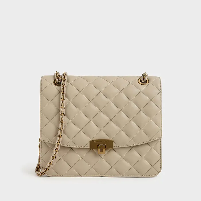 Túi Đeo Chéo Nữ Charles & Keith CNK Quilted Push-Lock Clutch CK2-70150587 Màu Be