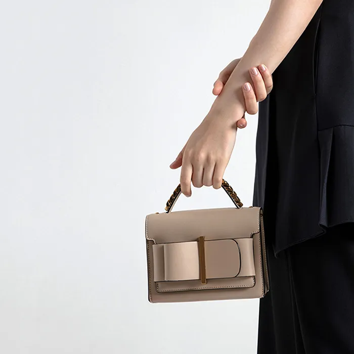 Túi Cầm Tay Nữ Charles & Keith CNK Chunky Metal Top Handle Bow Flap Bag CK2-50680795-1 Màu Be