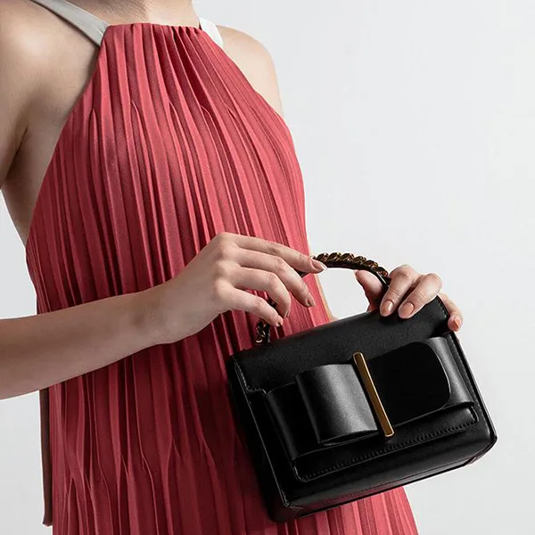 Túi Cầm Tay Nữ Charles & Keith CNK Chunky Metal Top Handle Bow Flap Bag CK2-50680795-1 Màu Đen
