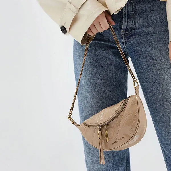 Túi Đeo Vai Nữ Charles & Keith CNK Wrinkled Patent Ring Zip Tassel Crossbody Bag 80150844 Màu Be