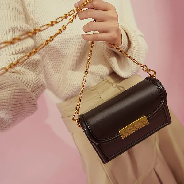 Túi Đeo Chéo Nữ Charles & Keith CNK Genevieve Metallic Push-Lock Clutch Dark Oak 70701152 Màu Nâu Đậm