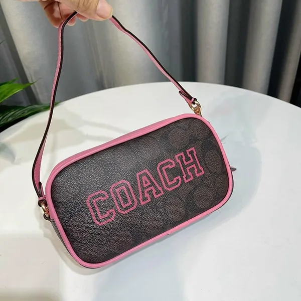 Coach Jamie Wristlet in Signature Canvas with Varsity Motif Pink for Women