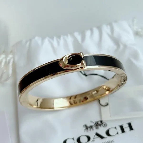 Vòng Đeo Tay Coach Signature Push Hinged Bangle F67480 Màu Đen Vàng