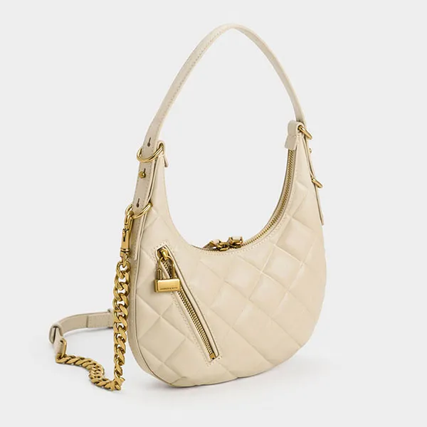 Túi Đeo Vai Nữ Charles & Keith CNK Swing Padlock Quilted Crescent Bag 40271240 Màu Beige