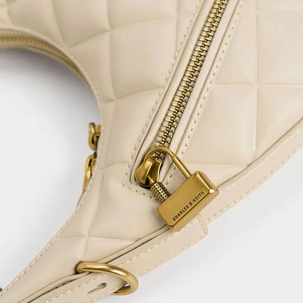 Túi Đeo Vai Nữ Charles & Keith CNK Swing Padlock Quilted Crescent Bag 40271240 Màu Beige
