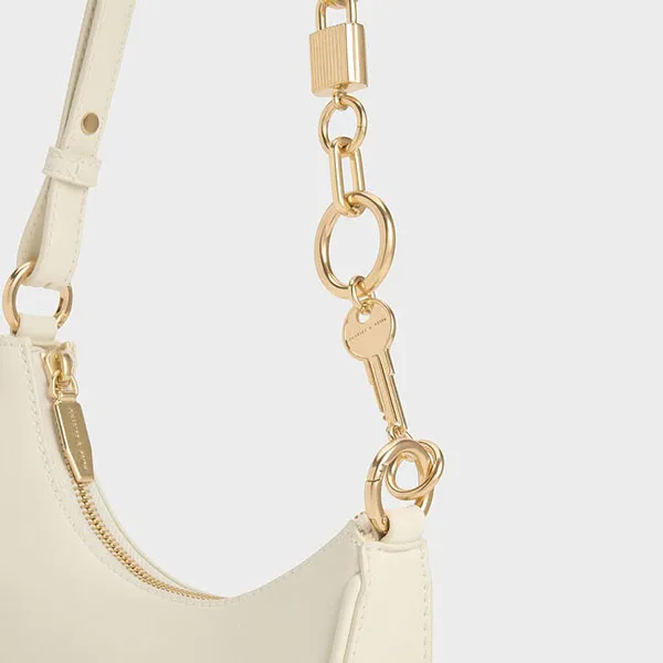 Túi Đeo Vai Nữ Charles & Keith CNK Lock & Key Chain Handle Trapeze Bag 20271269 Màu Cream