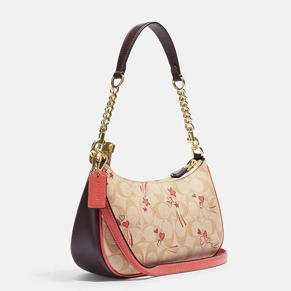 Túi Đeo Vai Nữ Coach Teri In Signature Canvas With Heart And Star Print CJ644 Màu Khaki/Hồng