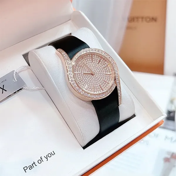 Đồng Hồ Nữ X-Cer Quartz Rose Gold Dial B0632 Màu Đen Vàng Hồng