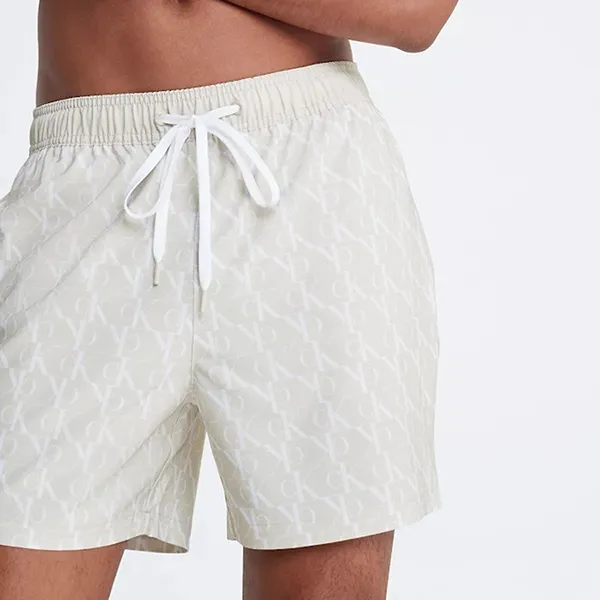 Quần Short Nam Calvin Klein CK Allover Monogram Logo Swim Shorts Màu Trắng Kem Size S