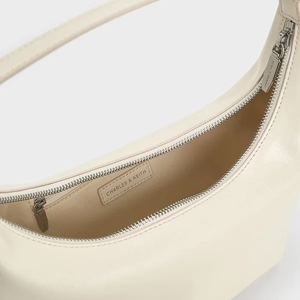 Túi Đeo Vai Nữ Charles & Keith CNK Bryna Metallic Curved Hobo Bag Cream CK2-40782526 Màu Kem - Túi xách - Vua Hàng Hiệu