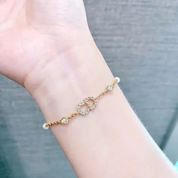 Vòng Đeo Tay Nữ Dior Gold Finish Metal White Resin Pearls And White Crystals B0668CDLCY_D301 Màu Vàng