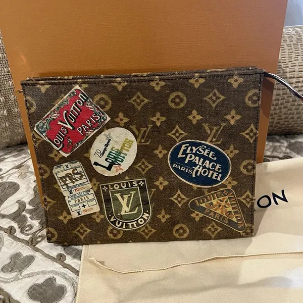 Túi Cầm Tay Louis Vuitton LV Monogram Flight Mode Pouch Màu Nâu