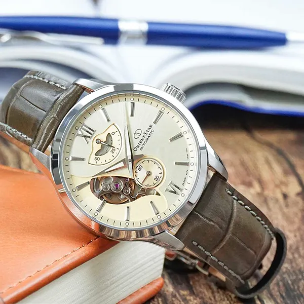 Đồng Hồ Nam Orient Star Layered Skeleton Re-AV0B10G00B Màu Nâu Be