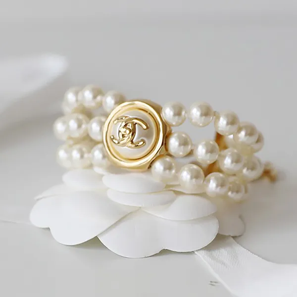 Vòng Đeo Tay Chanel Ngọc Trai CC Màu Trắng - Vàng - Trang sức - Vua Hàng Hiệu