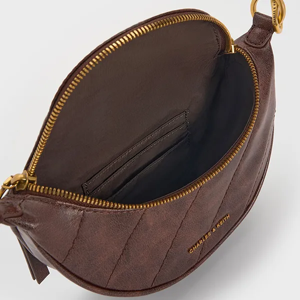 Túi Đeo Chéo Nữ Charles & Keith CNK Philomena Half-Moon Crossbody Bag Distressed Coffee CK2-00151593 Màu Nâu