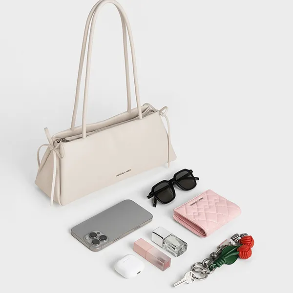 Túi Đeo Vai Nữ Charles & Keith CNK Hazel Bow Elongated Trapeze Shoulder Bag - Meringue White CK2-20160193 Màu Trắng