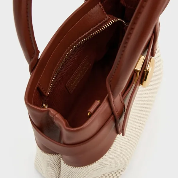 Túi Xách Tay Nữ Charles & Keith CNK Mini Behn Canvas Belted Trapezoid Handbag Brick CK2-30782821 Màu Be Nâu