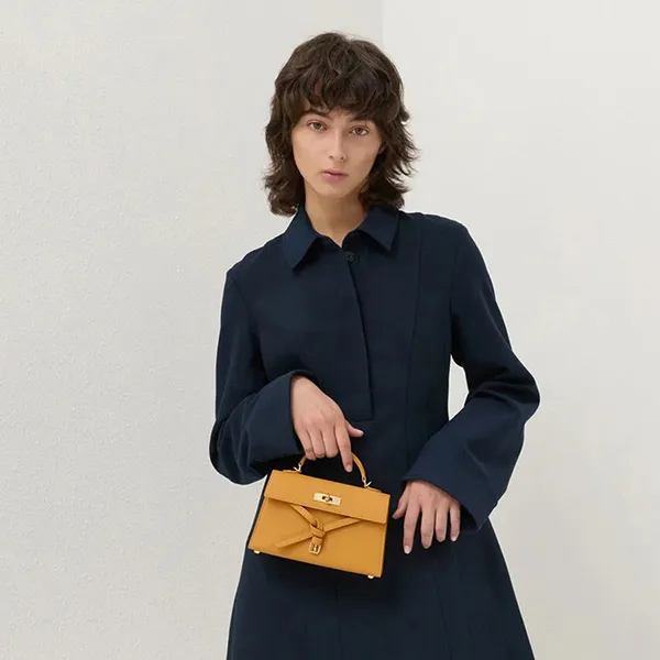 Túi Xách Tay Nữ Charles & Keith CNK Tricha Knotted Belt Top Handle Bag CK2-50701691 Saffron Yellow Màu Vàng