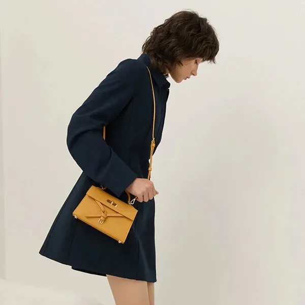 Túi Xách Tay Nữ Charles & Keith CNK Tricha Knotted Belt Top Handle Bag CK2-50701691 Saffron Yellow Màu Vàng