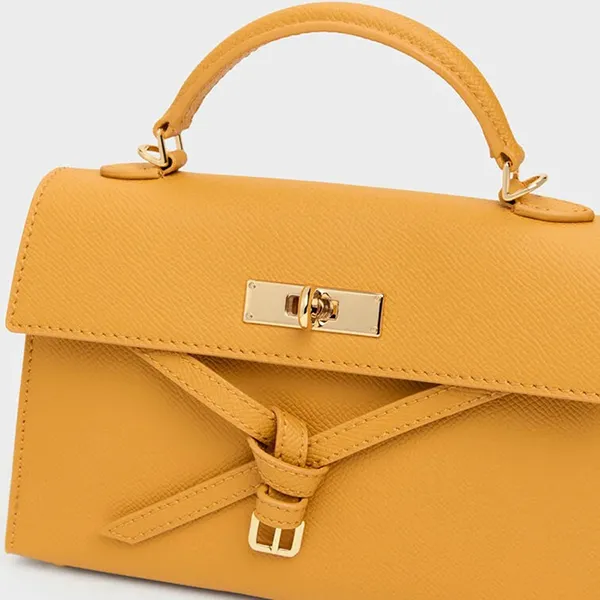 Túi Xách Tay Nữ Charles & Keith CNK Tricha Knotted Belt Top Handle Bag CK2-50701691 Saffron Yellow Màu Vàng