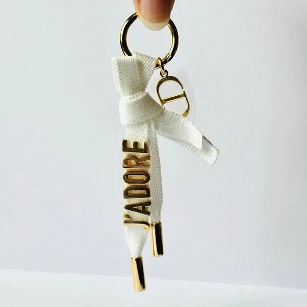 Móc Khóa Dior J’Adore Key Ring Gold Ribbon Keychain Màu Vàng/Trắng