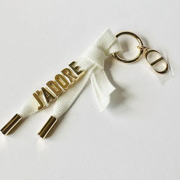 Móc Khóa Dior J’Adore Key Ring Gold Ribbon Keychain Màu Vàng/Trắng