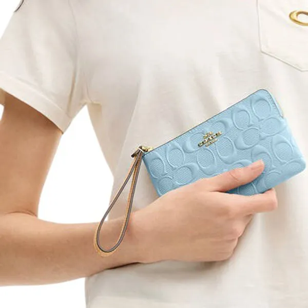 Ví Nữ Coach Corner Zip Wristlet In Signature Leather With Charm CEX36 Màu Xanh Nhạt